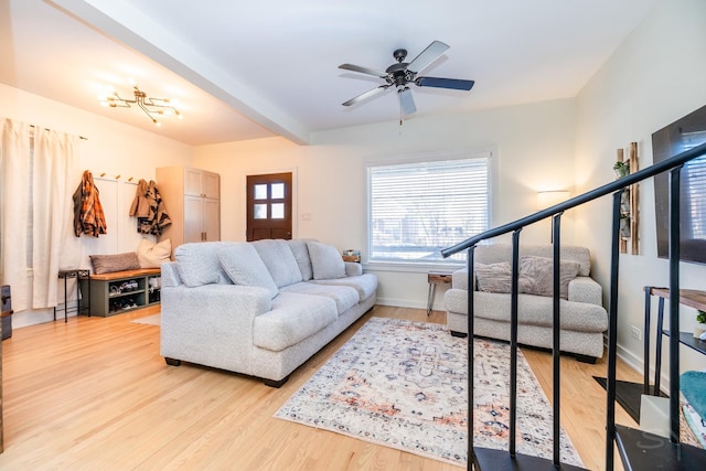 living room featuring ceiling fan and light hardwood / wood-style floors