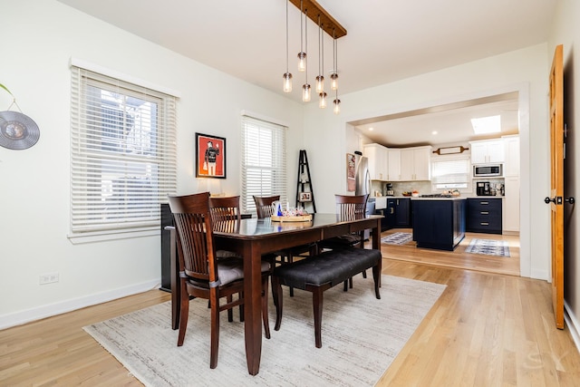 dining space featuring light hardwood / wood-style floors