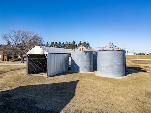 view of pole building with a yard