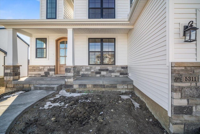 entrance to property with a porch