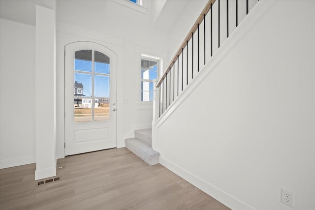 foyer entrance with light wood-type flooring