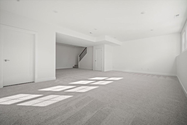 bonus room featuring light colored carpet