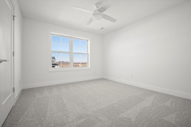 unfurnished room featuring carpet floors and ceiling fan