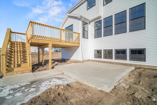 rear view of property with a patio area and a deck