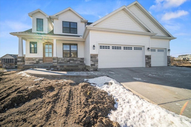 view of front of house with a garage and a porch