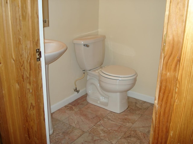 bathroom featuring toilet