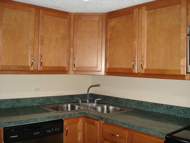 kitchen featuring sink, a textured ceiling, and dishwasher