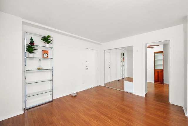 unfurnished room with wood-type flooring