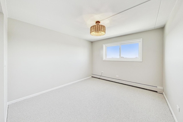 empty room with a baseboard radiator and light carpet