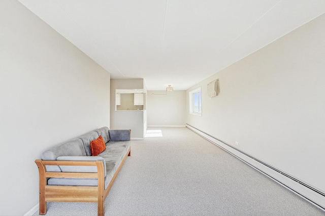 living room featuring a baseboard heating unit and carpet flooring