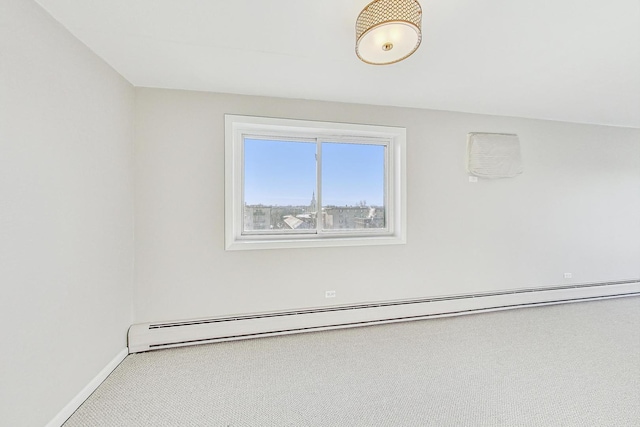 spare room with a baseboard radiator and carpet flooring