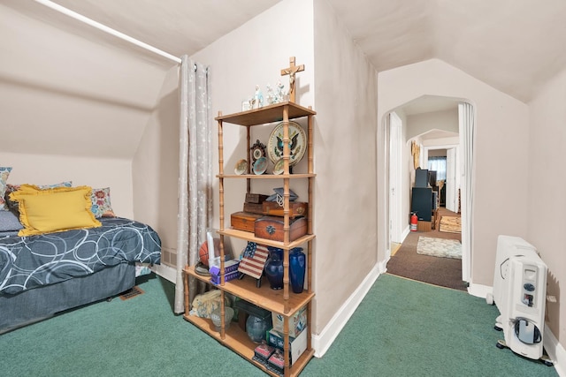 carpeted bedroom featuring lofted ceiling