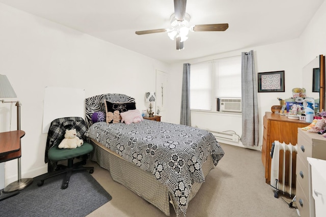 carpeted bedroom featuring cooling unit and ceiling fan