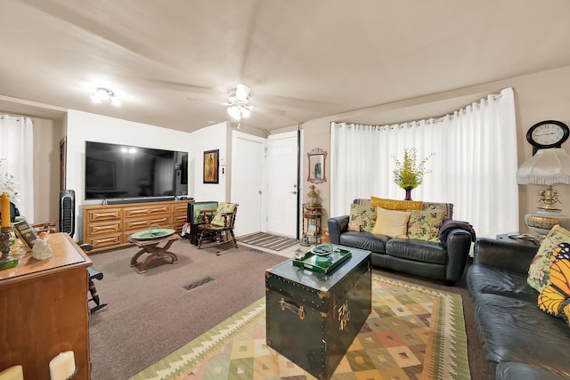 carpeted living room featuring ceiling fan