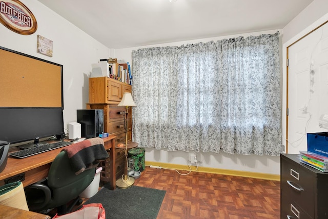 home office featuring dark parquet flooring