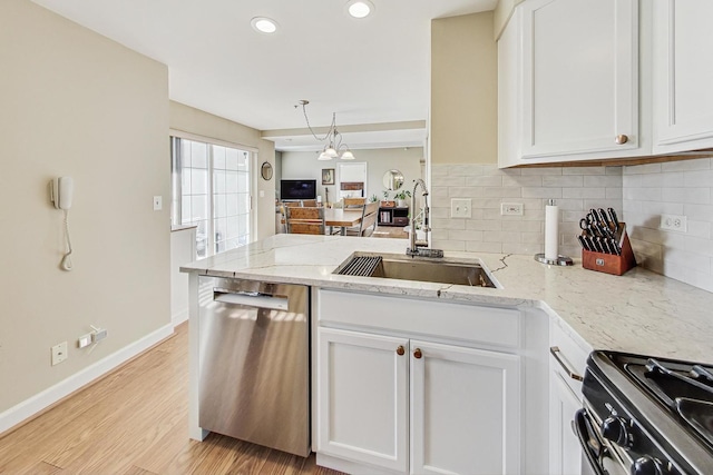 kitchen featuring sink, white cabinets, and stainless steel dishwasher