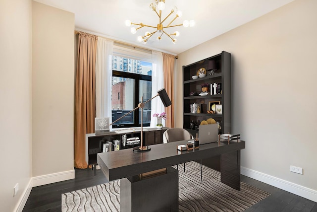 home office featuring an inviting chandelier and dark wood-type flooring