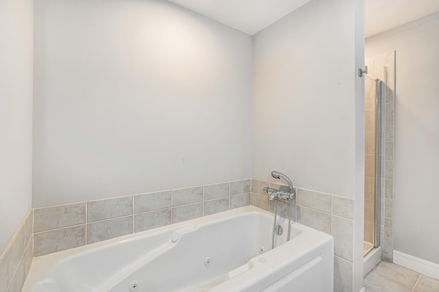 bathroom featuring tile patterned floors and plus walk in shower