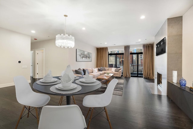 dining room featuring dark wood-type flooring and a notable chandelier