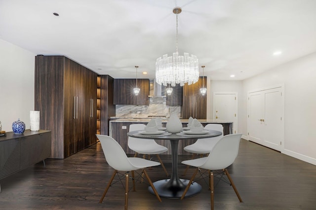 dining room with dark wood-type flooring and a chandelier