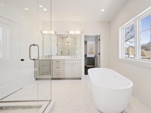 bathroom featuring vanity and shower with separate bathtub