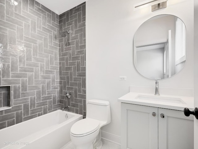 full bathroom with vanity, toilet, and tiled shower / bath