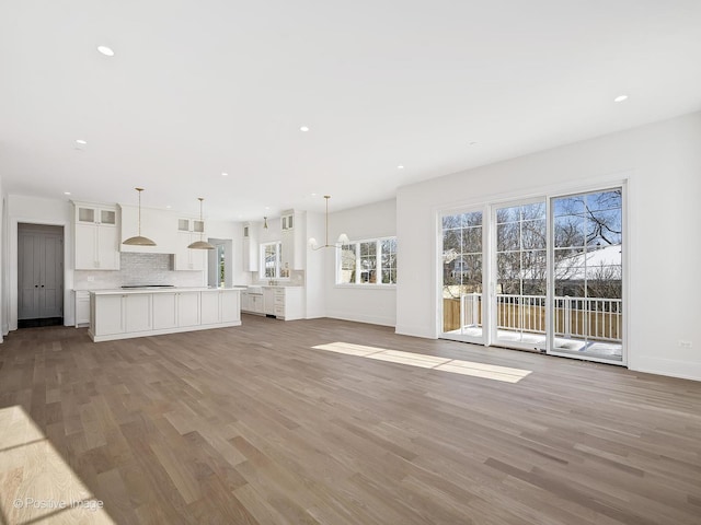 unfurnished living room featuring light wood-type flooring