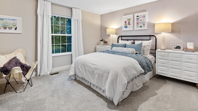 bedroom with light carpet