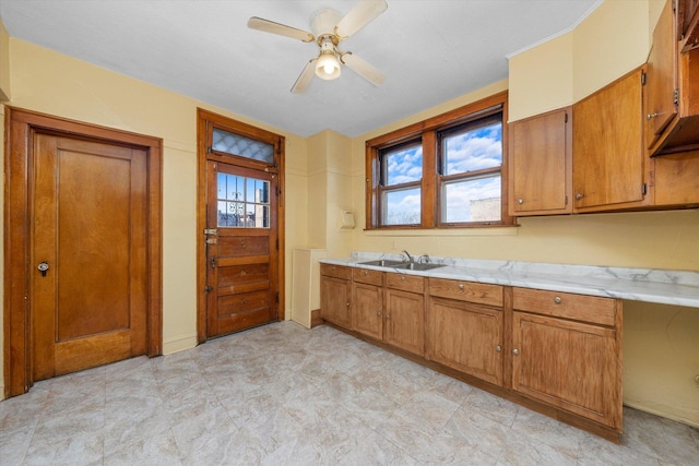 kitchen featuring sink and ceiling fan