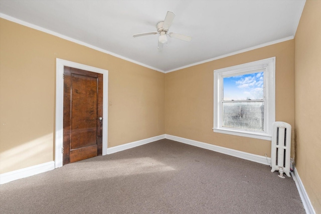 carpeted spare room featuring crown molding, radiator, and ceiling fan