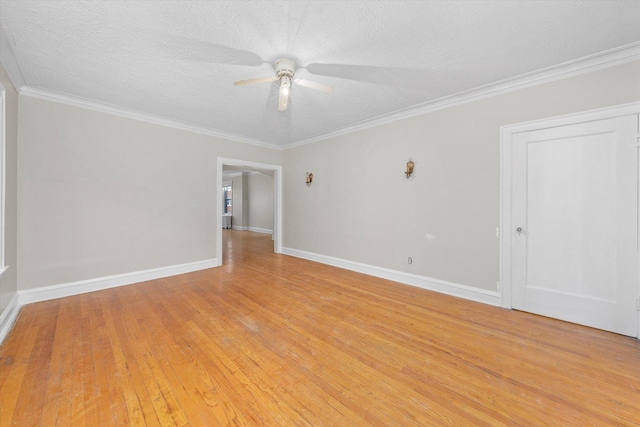 unfurnished room featuring light hardwood / wood-style floors, a textured ceiling, and ornamental molding