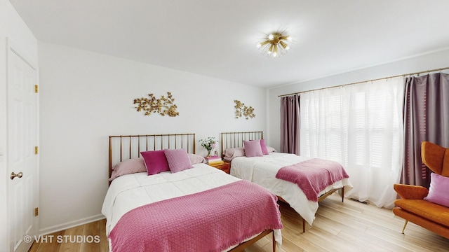 bedroom with hardwood / wood-style flooring