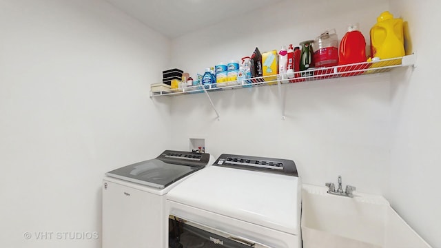 laundry area with independent washer and dryer