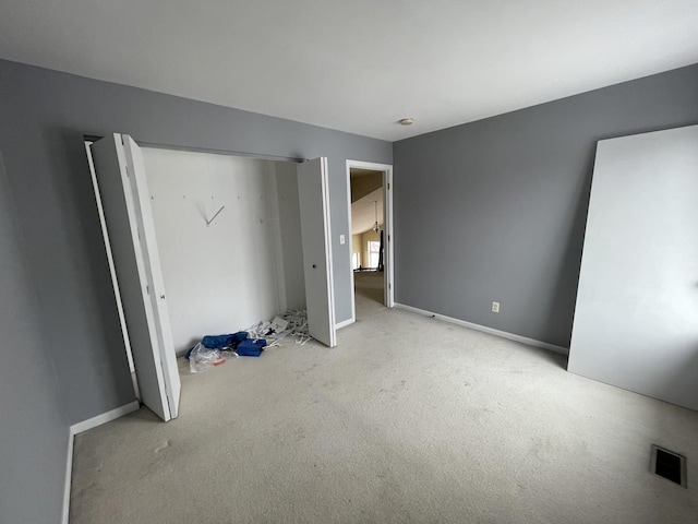 unfurnished bedroom with light carpet