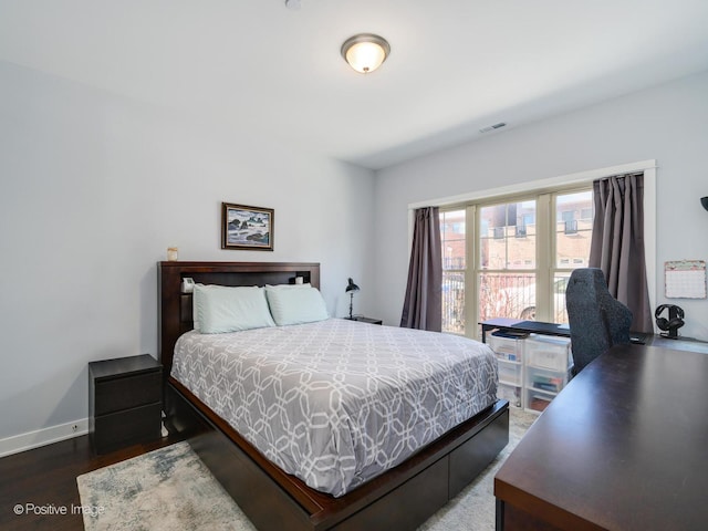 bedroom featuring dark wood-type flooring