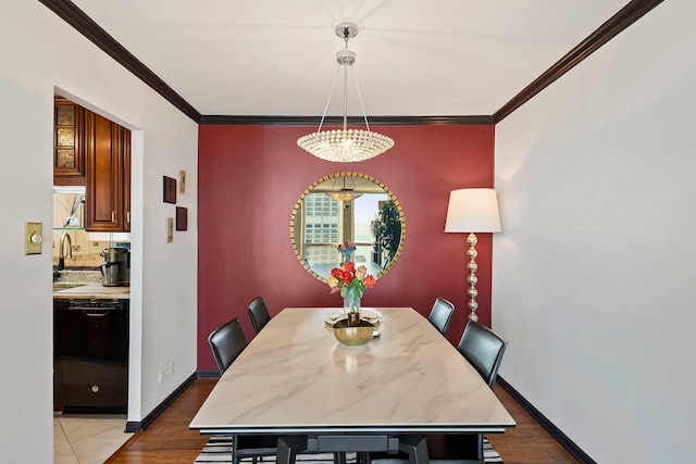 dining area featuring crown molding and hardwood / wood-style floors