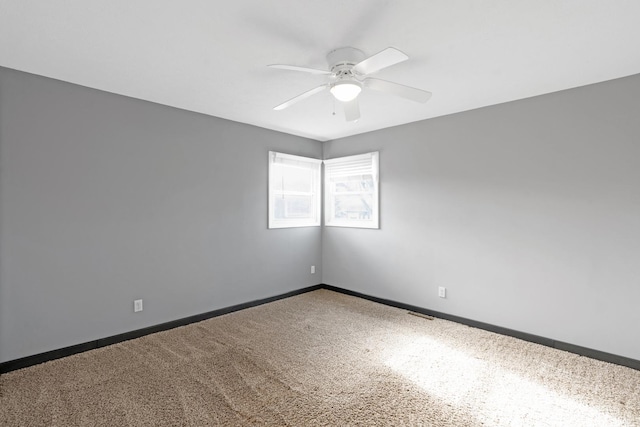 unfurnished room with ceiling fan