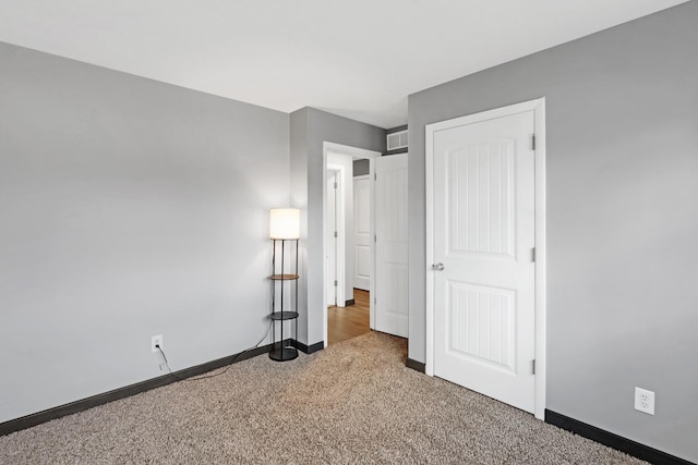 unfurnished bedroom with carpet flooring