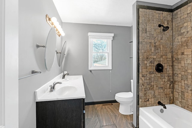 full bathroom featuring vanity, toilet, and tiled shower / bath combo