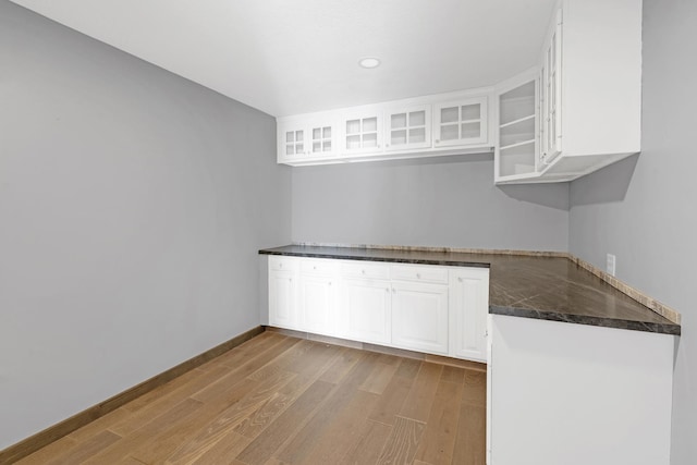 kitchen featuring white cabinetry and light wood-type flooring