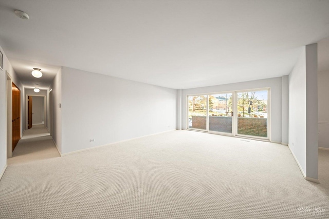 empty room featuring light colored carpet