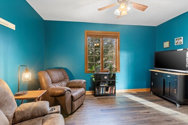 sitting room with hardwood / wood-style flooring and ceiling fan