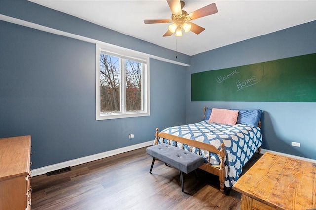 bedroom with dark wood-type flooring and ceiling fan