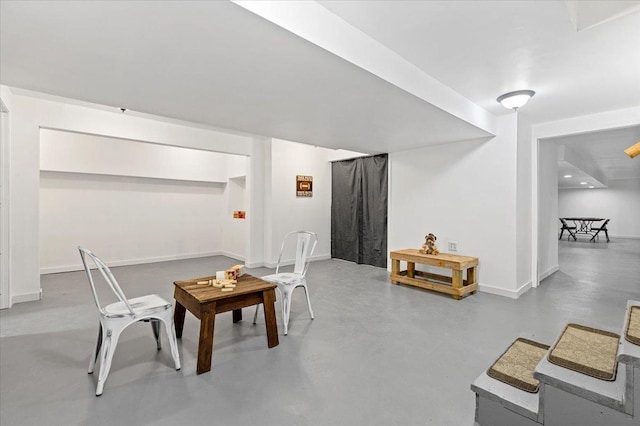 dining room featuring concrete flooring