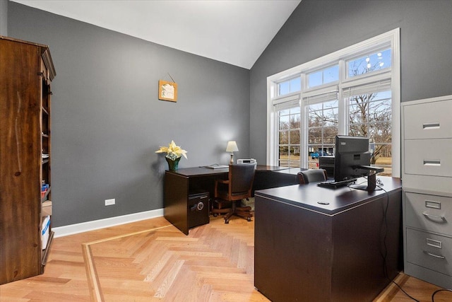 office featuring light parquet flooring and high vaulted ceiling