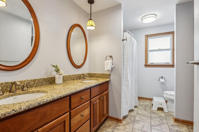 bathroom with vanity and toilet