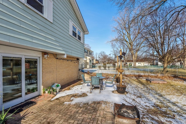 view of snow covered patio