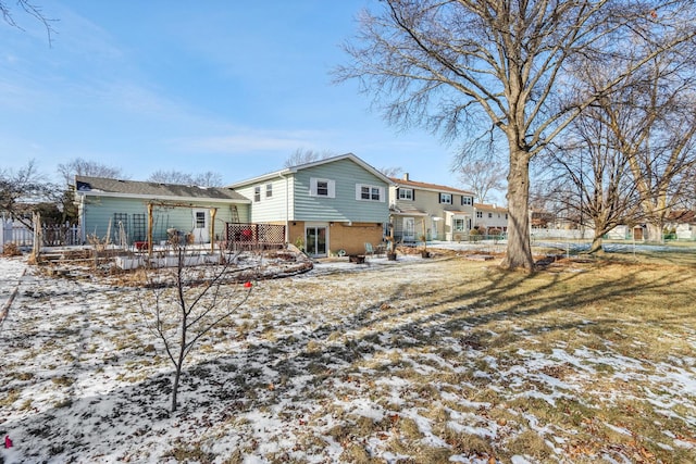 snow covered property featuring a wooden deck