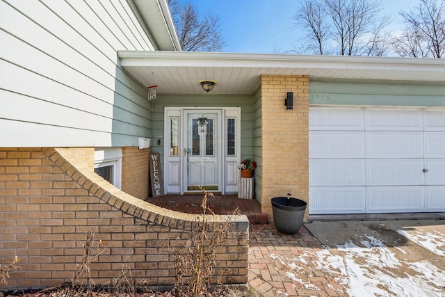 doorway to property featuring a garage