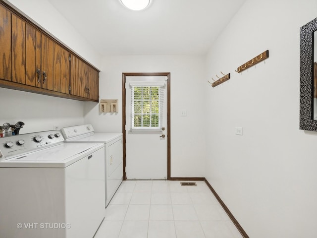 laundry area with cabinets and independent washer and dryer